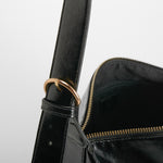 Bolso bandolera acabado brillo negro PICCOLA PIU