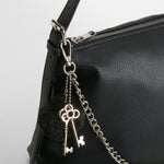 Bolso hombro cadenas negro PICCOLA PIU